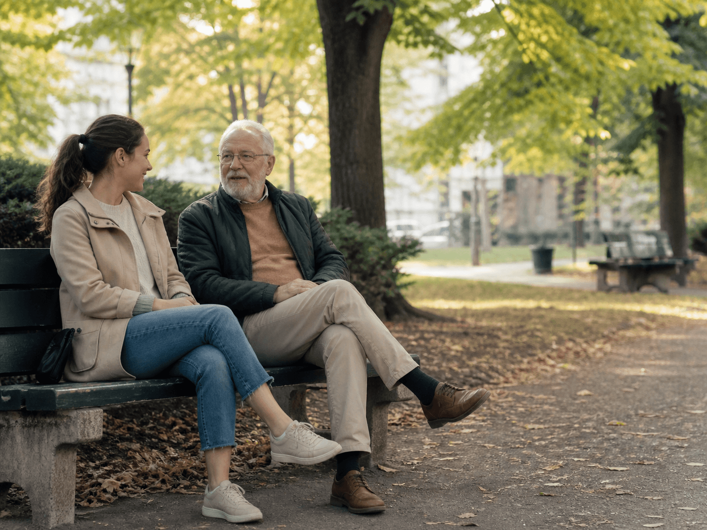 A young companion and an older adult walking and talking in a Montréal park